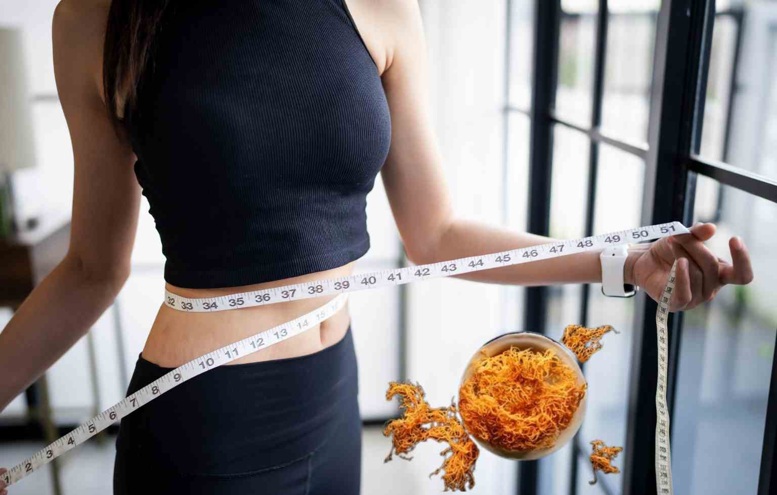 woman measuring waist with sea moss